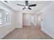 Bright bedroom featuring sleek laminate floors, a ceiling fan and natural light at 1401 E Clark Ave, Las Vegas, NV 89101