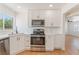 Bright kitchen with stainless steel appliances, white cabinets, and modern countertops at 1401 E Clark Ave, Las Vegas, NV 89101