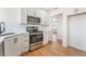 Bright kitchen with stainless steel range, microwave, white cabinets, and modern countertops at 1401 E Clark Ave, Las Vegas, NV 89101
