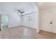 Bright living room featuring sleek laminate floors, a ceiling fan and natural light at 1401 E Clark Ave, Las Vegas, NV 89101