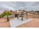 A gazebo on a concrete patio, surrounded by rocks, creates a serene outdoor escape in this backyard at 1744 La Cruz Dr, Henderson, NV 89014