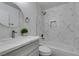 Updated bathroom featuring marble tile, modern vanity with marble countertop, and shower-tub combination at 1744 La Cruz Dr, Henderson, NV 89014