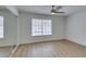 Bedroom with wood-look floors, a large window, and a closet with mirrored doors at 1744 La Cruz Dr, Henderson, NV 89014