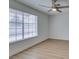 Bedroom featuring hardwood floors, a window with blinds, and fresh paint at 1744 La Cruz Dr, Henderson, NV 89014