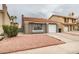 Charming single-story home with a red tile roof and low-maintenance landscaping at 1744 La Cruz Dr, Henderson, NV 89014