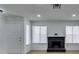 Inviting living room with modern black brick fireplace, bright natural light, and new floors at 1744 La Cruz Dr, Henderson, NV 89014