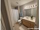 Bright bathroom with a shower-tub combo, vanity sink, and neutral decor at 1881 W Alexander Rd # 1035, North Las Vegas, NV 89032