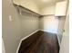 Walk-in closet with wood floor and rod and shelf system at 1881 W Alexander Rd # 1035, North Las Vegas, NV 89032