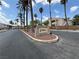 Community entrance with attractive brick signage and landscaping and mature palm trees at 1881 W Alexander Rd # 1035, North Las Vegas, NV 89032