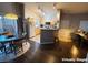 Open kitchen with wooden cabinets and a breakfast bar at 1881 W Alexander Rd # 1035, North Las Vegas, NV 89032