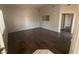 Bright living room features wood flooring and neutral paint, offering a versatile space at 1881 W Alexander Rd # 1035, North Las Vegas, NV 89032