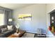 Bright living room with a comfortable gray sofa and stylish decor at 1881 W Alexander Rd # 1035, North Las Vegas, NV 89032