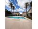Inviting community pool surrounded by lush palm trees and well-maintained landscaping at 1881 W Alexander Rd # 1035, North Las Vegas, NV 89032