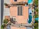 Aerial view of a single-story home with solar panels, private pool and spa, and well-maintained landscaping at 2024 Spruce Brook Dr, Henderson, NV 89074