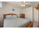 Relaxing bedroom with a ceiling fan, a cozy bed, and a chest of drawers at 2024 Spruce Brook Dr, Henderson, NV 89074