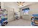 Bright bedroom featuring carpet, a ceiling fan, window with view, and closet at 2024 Spruce Brook Dr, Henderson, NV 89074