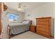 Comfortable bedroom with neutral decor, a ceiling fan, and natural light at 2024 Spruce Brook Dr, Henderson, NV 89074