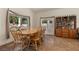 Charming dining room with wood table, chairs, and natural light at 2024 Spruce Brook Dr, Henderson, NV 89074