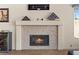Close-up of a stylish fireplace with decorative accents above the mantle at 2024 Spruce Brook Dr, Henderson, NV 89074