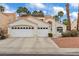Charming home with a three-car garage, well-maintained landscaping, and a terra cotta roof at 2024 Spruce Brook Dr, Henderson, NV 89074