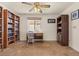 Inviting home office featuring built-in bookshelves, a window for natural light and a desk, perfect for work and study at 2024 Spruce Brook Dr, Henderson, NV 89074