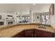 Granite countertops and modern cabinetry create a luxurious kitchen space at 2024 Spruce Brook Dr, Henderson, NV 89074