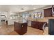 Open kitchen design with a view of living areas, featuring an island and stainless steel appliances at 2024 Spruce Brook Dr, Henderson, NV 89074