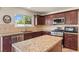 Well-equipped kitchen with stainless steel appliances, granite countertops, and ample cabinet space at 2024 Spruce Brook Dr, Henderson, NV 89074