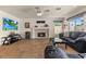 Bright living room with fireplace, tile flooring, and casual seating at 2024 Spruce Brook Dr, Henderson, NV 89074