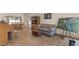 Cozy living room with tile floors, comfortable seating, and a bright window at 2024 Spruce Brook Dr, Henderson, NV 89074