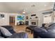 Open living room featuring a fireplace, tile floors, and comfortable seating at 2024 Spruce Brook Dr, Henderson, NV 89074