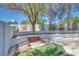 Backyard with tiered planting bed and hammock feature at 217 Windsong Dr, Henderson, NV 89074