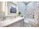 Updated bathroom with a shower/tub combo, a vanity with a sleek mirror, and a modern design at 217 Windsong Dr, Henderson, NV 89074