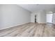 Large bedroom with wood floors, a walk-in closet, and access to the rest of the house at 217 Windsong Dr, Henderson, NV 89074