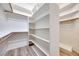 Spacious walk-in closet with plenty of shelving and hanging space for optimal organization and storage at 217 Windsong Dr, Henderson, NV 89074