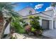 Elegant two-story home with desert landscaping and a private gated entrance, plus a two car garage at 217 Windsong Dr, Henderson, NV 89074