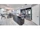 Contemporary kitchen boasts stainless steel appliances, an island, and gray wood-look flooring at 217 Windsong Dr, Henderson, NV 89074