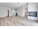 Expansive living room with wood floors, a fireplace, and access to multiple rooms at 217 Windsong Dr, Henderson, NV 89074