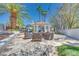 Backyard patio featuring gazebo, fire pit and outdoor seating at 217 Windsong Dr, Henderson, NV 89074