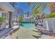 Lagoon style pool featuring a sandy bottom, waterfall and poolside gazebo at 217 Windsong Dr, Henderson, NV 89074