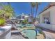 Resort style rock pool and spa with multiple areas for entertainment at 217 Windsong Dr, Henderson, NV 89074
