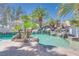 A luxurious custom pool boasts rock features, a waterfall, and lush landscaping, creating a tranquil oasis at 217 Windsong Dr, Henderson, NV 89074