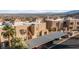 Aerial view of desert complex featuring covered parking, landscaping, and mountain views in background at 2191 Bay Club Dr # 204, Laughlin, NV 89029