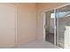 Balcony with beige stucco walls and glass sliding door to interior at 2191 Bay Club Dr # 204, Laughlin, NV 89029