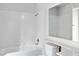 Bright bathroom featuring a tiled shower and tub combination with a large mirror at 2191 Bay Club Dr # 204, Laughlin, NV 89029