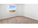 Cozy bedroom with carpet, white walls and bright window at 2191 Bay Club Dr # 204, Laughlin, NV 89029
