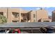 Exterior shot of complex featuring covered parking and desert landscaping with distant mountain view at 2191 Bay Club Dr # 204, Laughlin, NV 89029