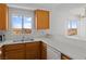 Kitchen with wood cabinets, sink with view and dishwasher at 2191 Bay Club Dr # 204, Laughlin, NV 89029