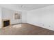 A bright living room offers a fireplace and comfortable carpeting at 2191 Bay Club Dr # 204, Laughlin, NV 89029