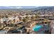 Overhead view of the community pool, townhouses, and desert landscape in a well-maintained neighborhood at 2191 Bay Club Dr # 204, Laughlin, NV 89029